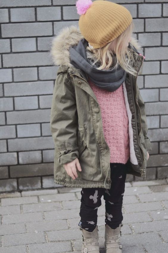 an olive green parka with a black scarf for a cool fall-inspired look