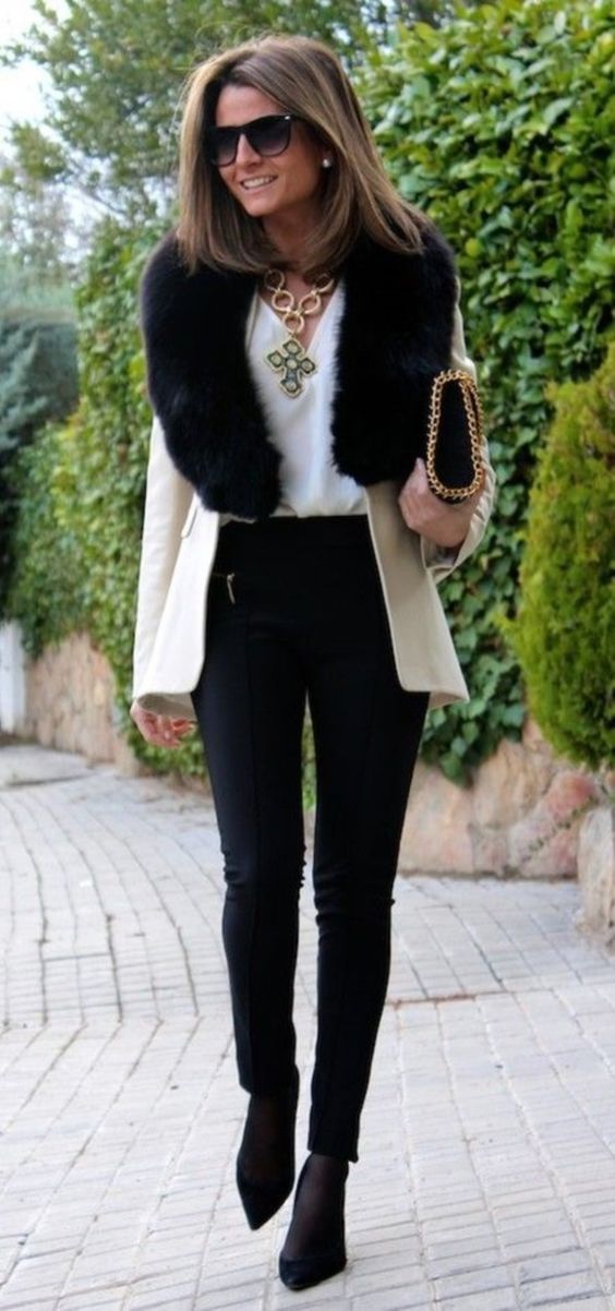 a creamy short coat with a black faux fur stole looks very elegant and chic