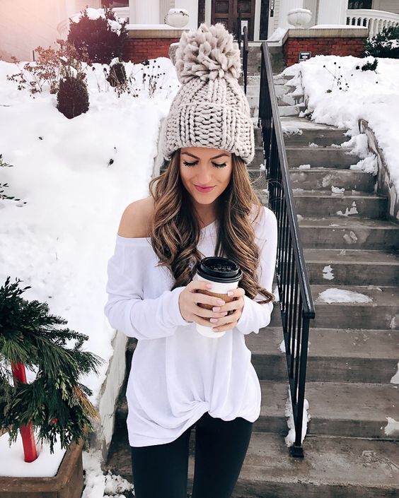 a cute light grey oversized beanie with a large pompom to make a statement