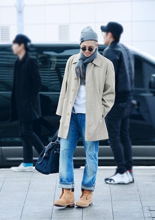 blue jeans, amber boots, a white tee, a neutral coat and a beanie