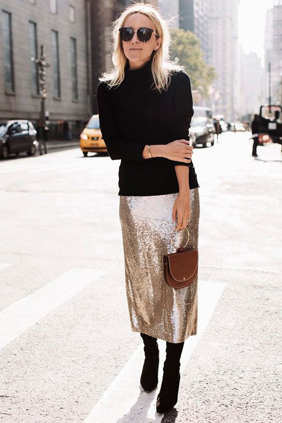 a black turtleneck, a champagne sequin midi skirt and black suede boots