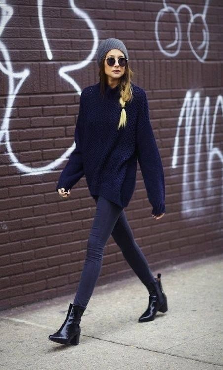dark denim, an oversized navy sweater, a grey beanie and black chelsea boots