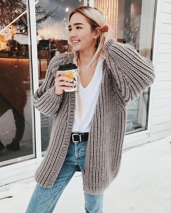 blue jeans, a white tee and a comfy neutral chunky knit cardigan