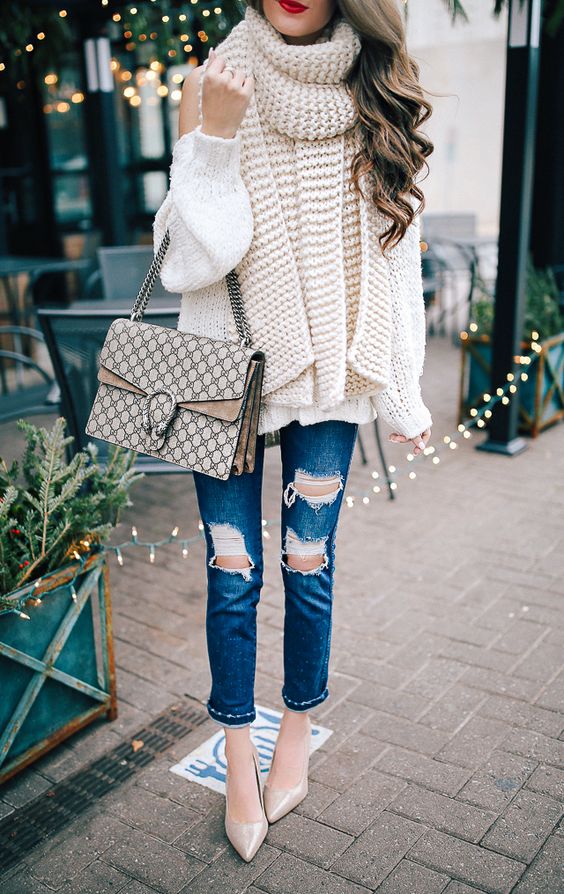 a creamy off the shoulder sweater, a scarf of the same shade, ripped denim, nude shoes and a bag