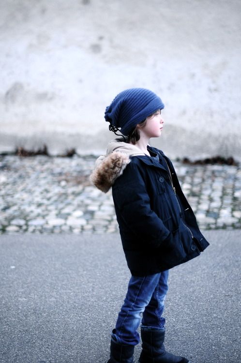 a navy parka with faux fur, denim and navy ugg boots