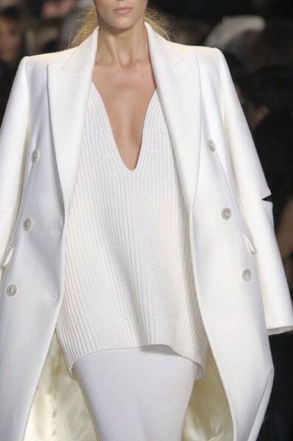 a white pencil skirt, an oversized plunging neckline chunky knit sweater and a white coat for a sexy look