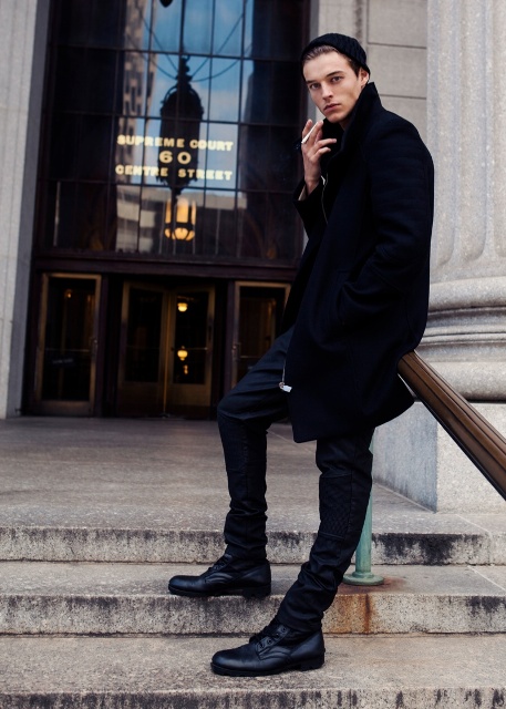 Black beanie, coat, pants and leather boots