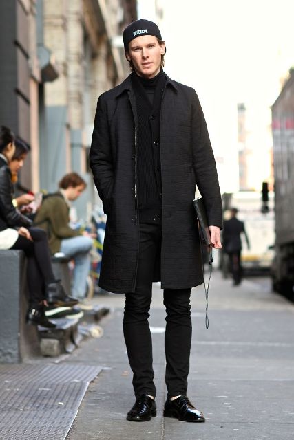 Black cardigan, coat, trousers, shoes and cap