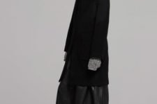 Black knee-length coat, leather maxi skirt and heeled boots