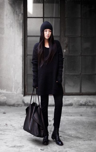 Black long sweater with straight pants, ankle boots, beanie and tote