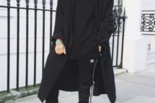 Black loose shirt, sporty pants, black and white sneakers and midi coat
