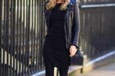 Black mini dress with leather jacket, beanie with pom pom and mid calf boots
