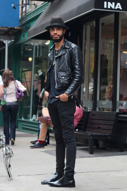 Black t shirt, leather jacket, skinny pants, shoes and wide brim hat