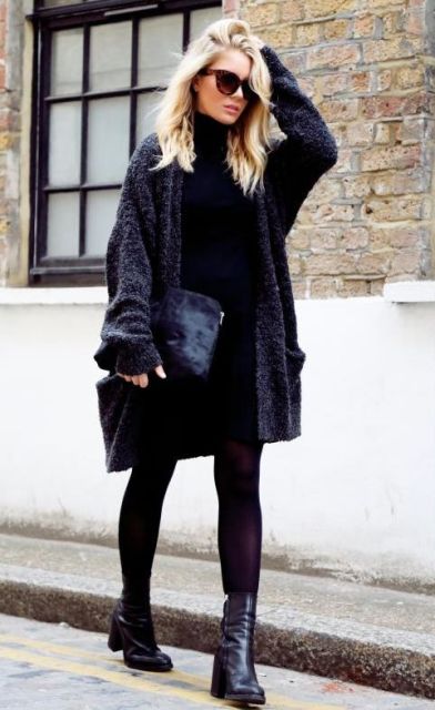 Oversized cardigan with black dress, clutch and heeled boots