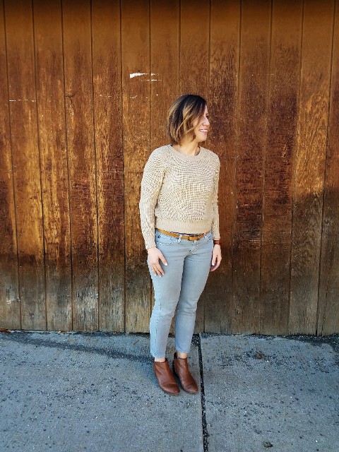 With beige sweater and brown boots