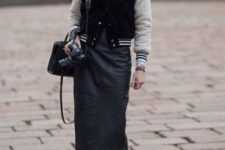 With black midi skirt, navy blue boots, cap, mini bag and white turtleneck
