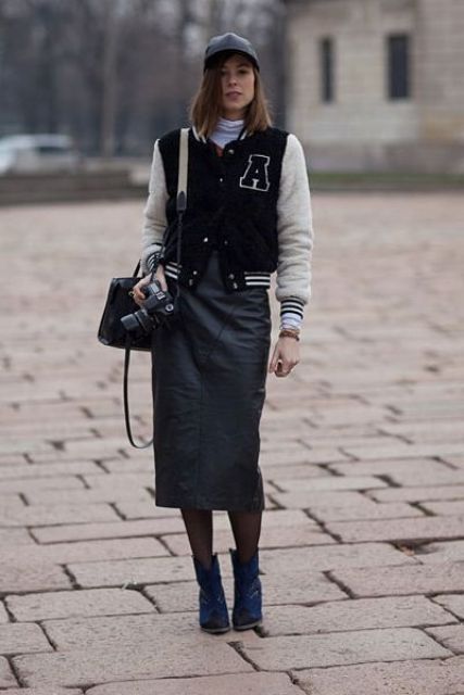 With black midi skirt, navy blue boots, cap, mini bag and white turtleneck