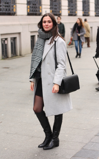 With black skirt, white coat, black bag and high boots