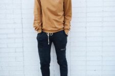 With brown sweatshirt and white sneakers