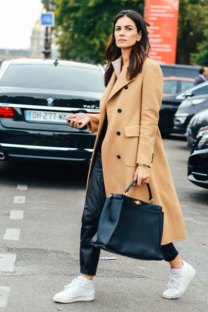 With camel midi coat, white sneakers and black tote