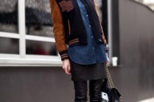 With denim shirt, leather pants, brown ankle boots and chain strap bag