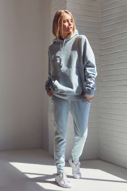 With gray hoodie and white sneakers