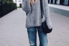 With gray oversized sweater, white sneakers and small bag