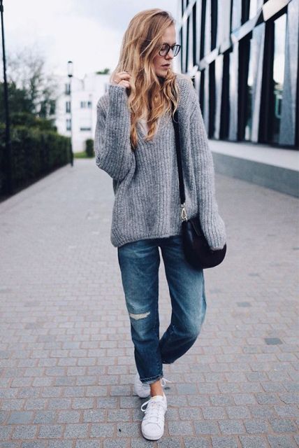 With gray oversized sweater, white sneakers and small bag