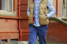 With light blue shirt, puffer vest and brown suede boots