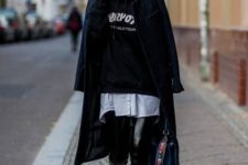 With long shirt, sweatshirt, white sneakers, navy blue coat and bag