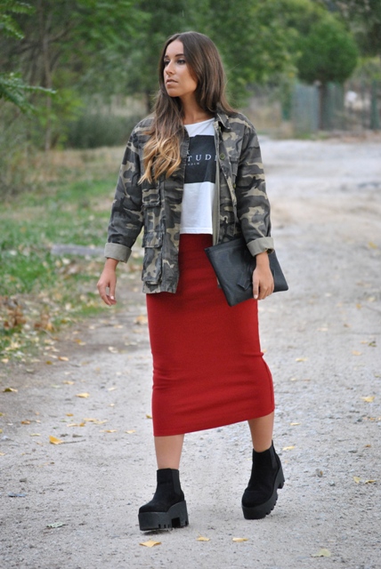 With loose t shirt, military jacket, clutch and red mini skirt