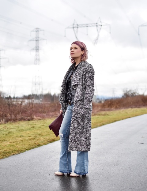 With midi coat, brown clutch and white boots