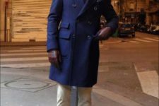 With navy blue coat, beanie and leather shoes