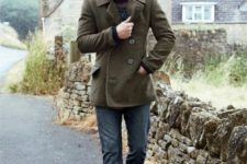 With olive green jacket and brown shoes
