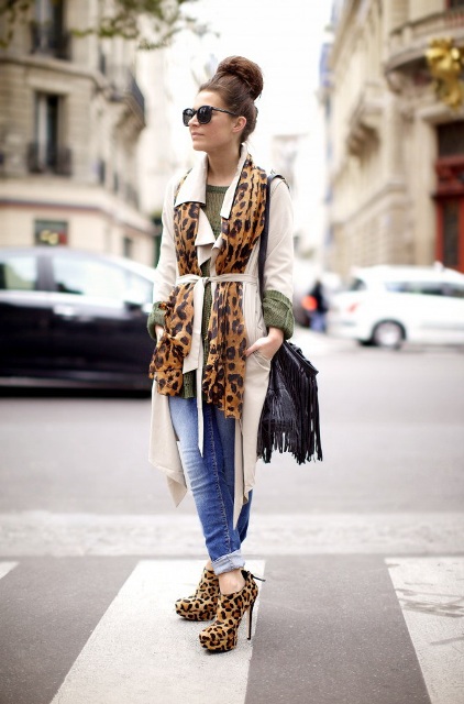 With olive green shirt, leopard print scarf, white trench coat, fringe bag and cuffed jeans