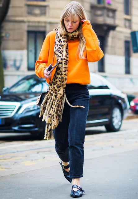 With orange sweater, leopard printed scarf and cutout shoes