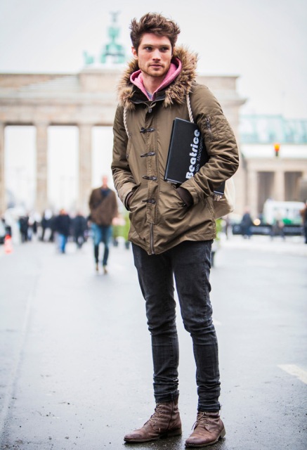 With pink hoodie, jeans and brown boots