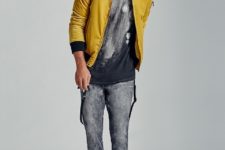 With printed t-shirt, gray jeans and black shoes