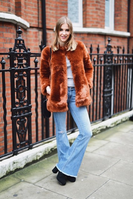 With shirt, fur jacket and black boots