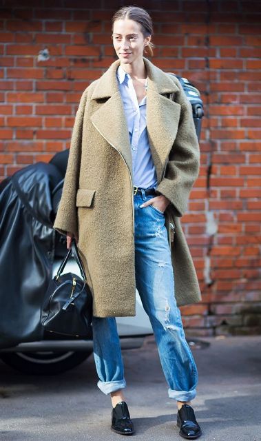 With white button down shirt, black shoes, black bag and oversized coat