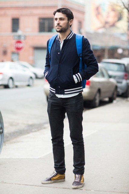 With white shirt, straight pants, blue backpack and two color sneakers