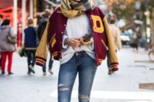 With white sweater, distressed jeans, brown ankle boots, beanie and plaid scarf