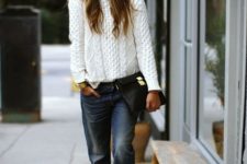 With white sweater, printed cutout boots, clutch and beanie