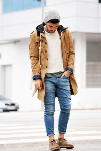 With white sweater, suede boots and brown parka