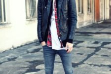 With white t-shirt, black leather jacket and black shoes
