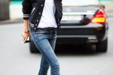 With white t-shirt, skinny jeans and black high heels