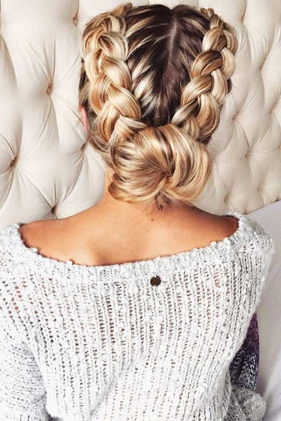 a comfy updo with two braids and a low bun looks cute and casual
