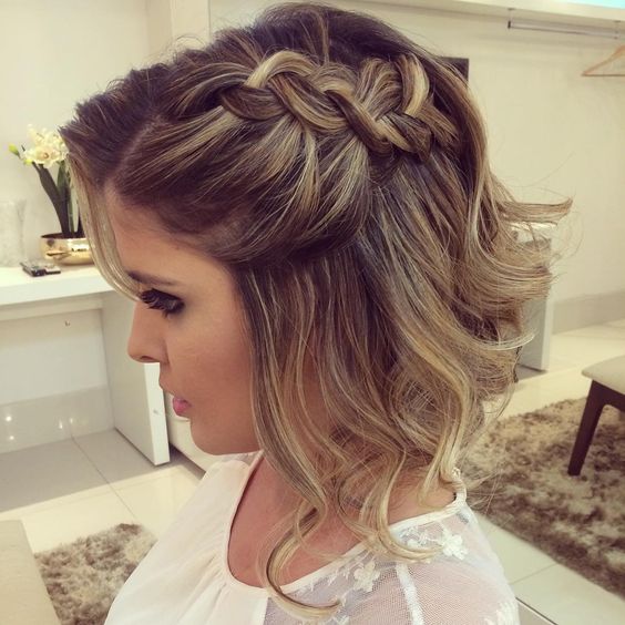 wavy short hair with a large braid on one side for a chic look