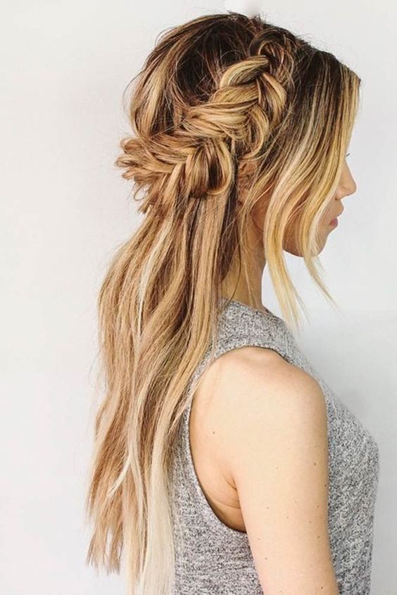 a half up fishtail braid hairstyle with bangs and hair down