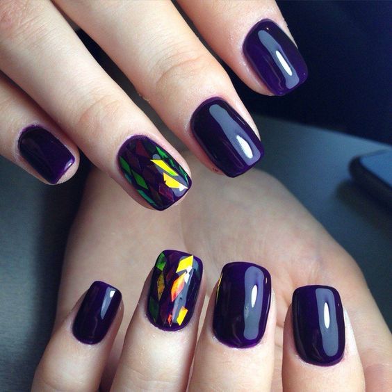 deep violet nails with holographic accents for those who love geometry